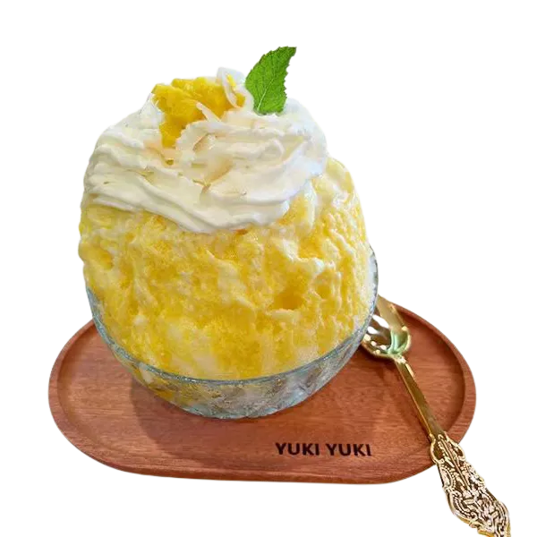 Sweet mango kakigori with cream and mint leaf at Yuki Yuki, a Bubble Tea Store in San Diego